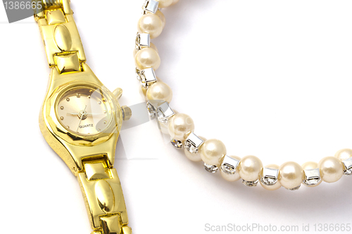 Image of Golden wrist watch and necklace 