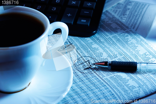 Image of cup and calculator