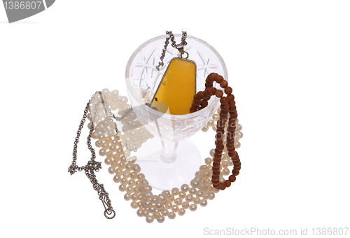 Image of Women's jewelry and glass. 