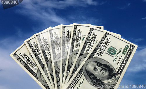 Image of money over sky