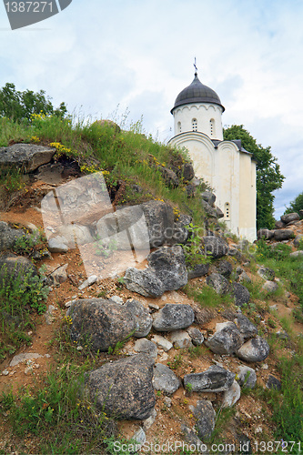 Image of aging christian church amongst stone