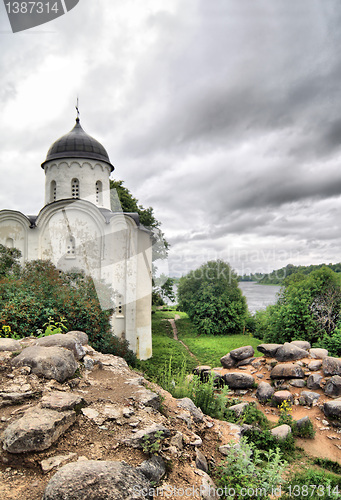 Image of aging church on stone hill