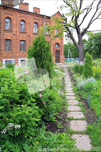 Image of lane in park near old-time building