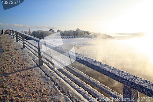 Image of town bridge on cool river