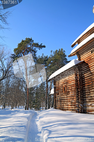 Image of snow lane near rural building