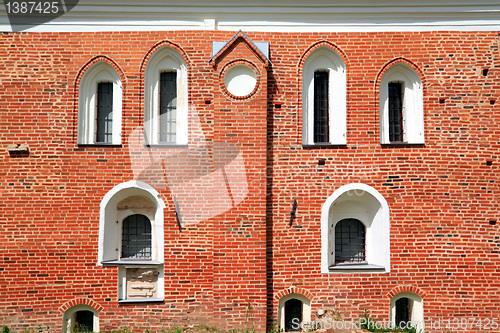 Image of white window in red brick wall