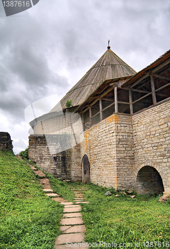 Image of aging fortress on green hill