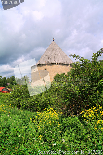 Image of tower to old fortress amongst green tree