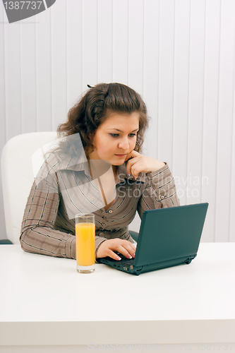 Image of The young business woman at office