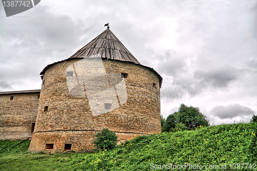 Image of ancient fortress on green hill