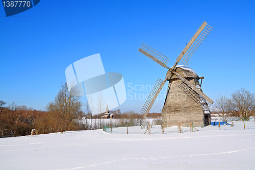 Image of aging mill on winter field