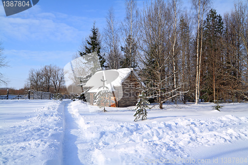 Image of rural house near snow lane