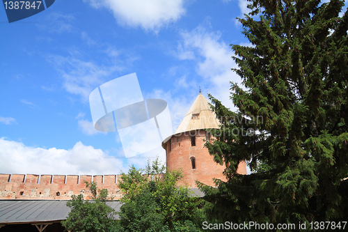 Image of tower to old-time fortress on celestial background