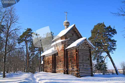 Image of wooden chapel in winter wood