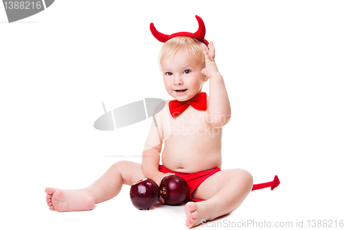 Image of kid in red suit of tempting devil 