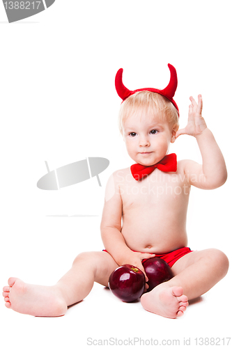 Image of kid in red suit of tempting devil 