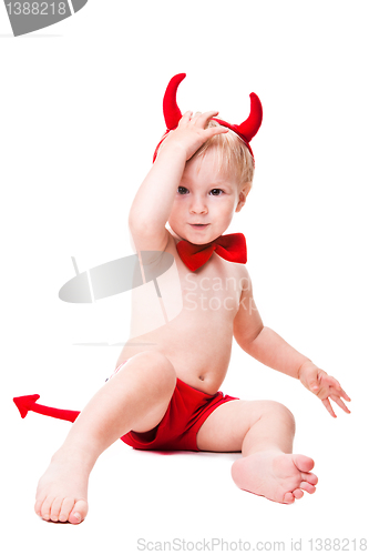 Image of kid in red suit of tempting devil 