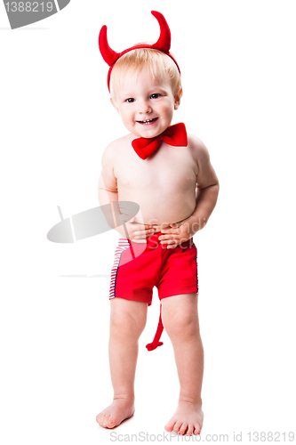 Image of kid in red suit of tempting devil 