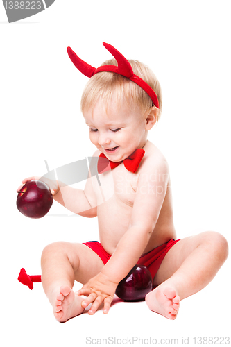 Image of kid in red suit of tempting devil 