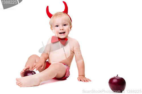 Image of kid in red suit of tempting devil 