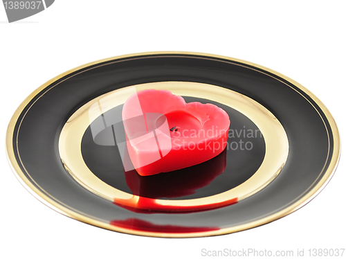 Image of heart candle on a plate