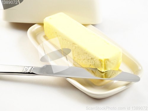 Image of butter on a white butterdish 