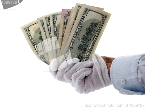 Image of hand holding money