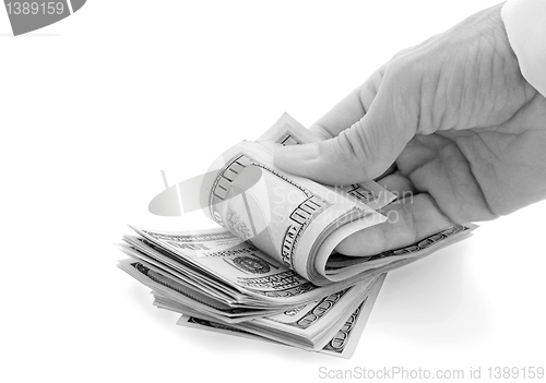 Image of hand fingers pile of dollars