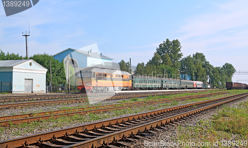 Image of passenger train on railway station