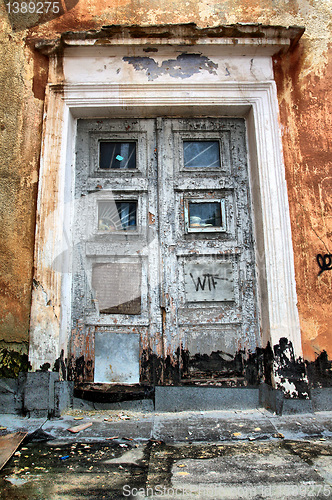 Image of aging door in destroyed house