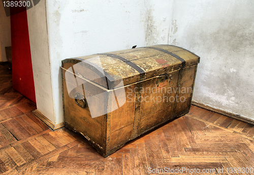 Image of old coffer on dirty floor