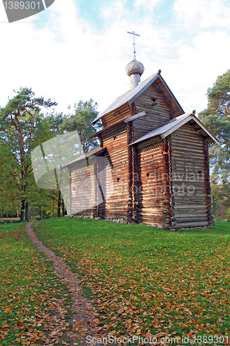 Image of wooden chapel in autumn wood