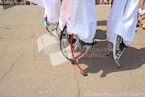 Image of people on stilt