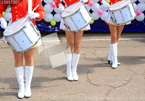 Image of three girls with drum