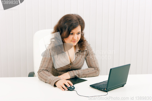 Image of The young woman with laptop