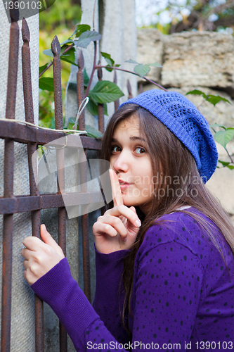 Image of Brunette girl showing silence sign