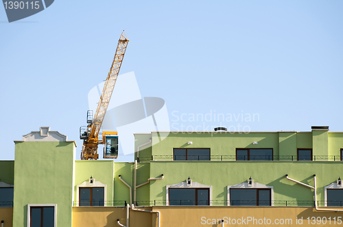 Image of New colored building and crane