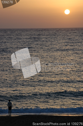 Image of Person watching sunset