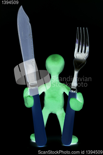 Image of Shaded puppet  standing with tableware