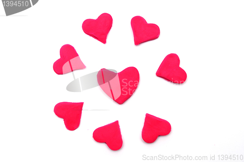 Image of Painted pink hearts of plasticine on background