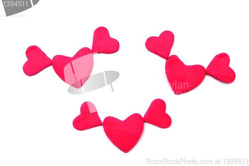 Image of Painted pink hearts of plasticine on background