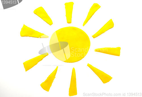 Image of Painted yellow sun of plasticine on background