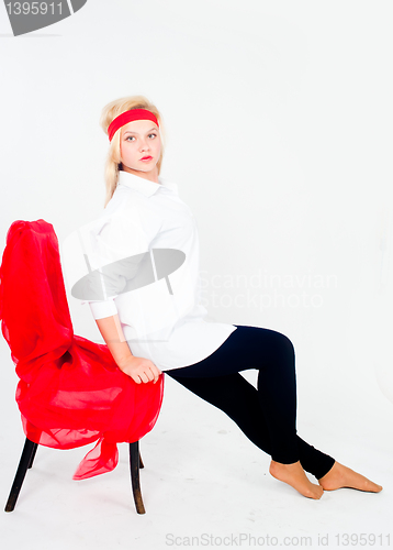 Image of Pretty girl relaxing on chair