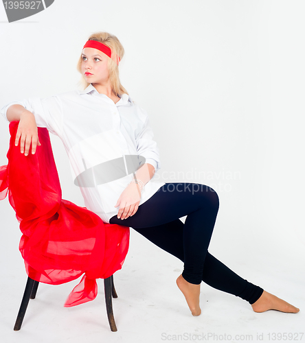 Image of Pretty girl relaxing on chair