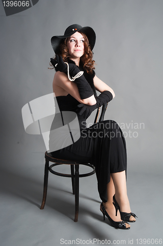 Image of Pretty woman on chair