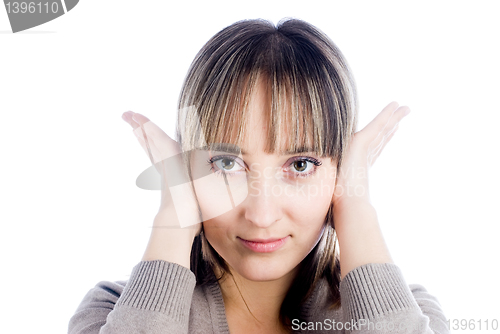 Image of Woman covering her ears