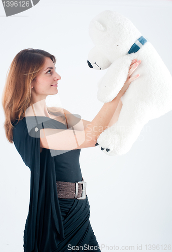 Image of Smiling woman with bear toy