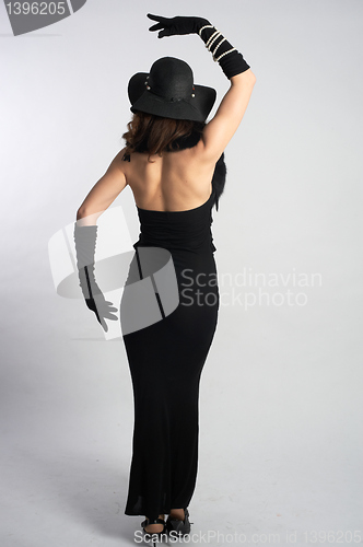 Image of Rear view of pretty woman