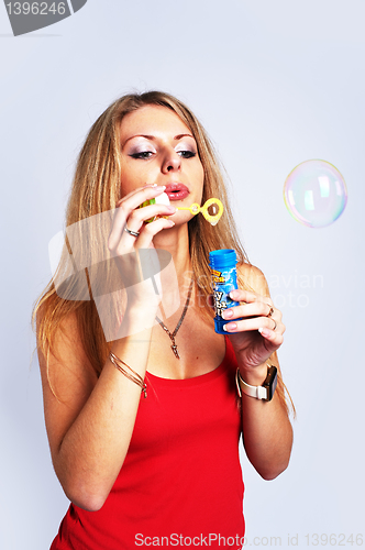 Image of Pretty girl with soap bubbles