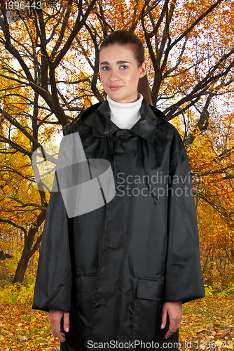 Image of woman in rain coat